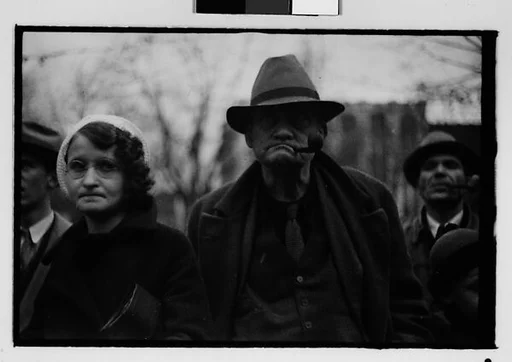 [Four 35mm Film Frames: Old Man, Woman, and Child Watching Parade, Johnstown, Pennsylvania]