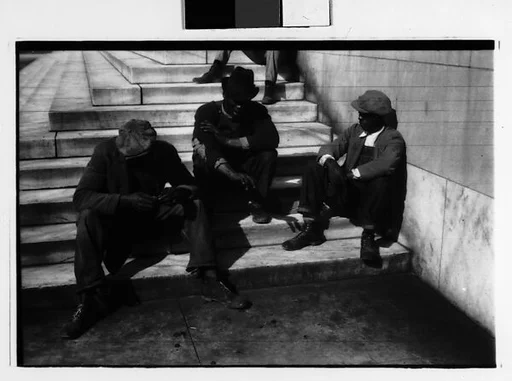 [Two 35mm Film Frames: Men Seated on Steps of Public Building, Southeastern U.S.]