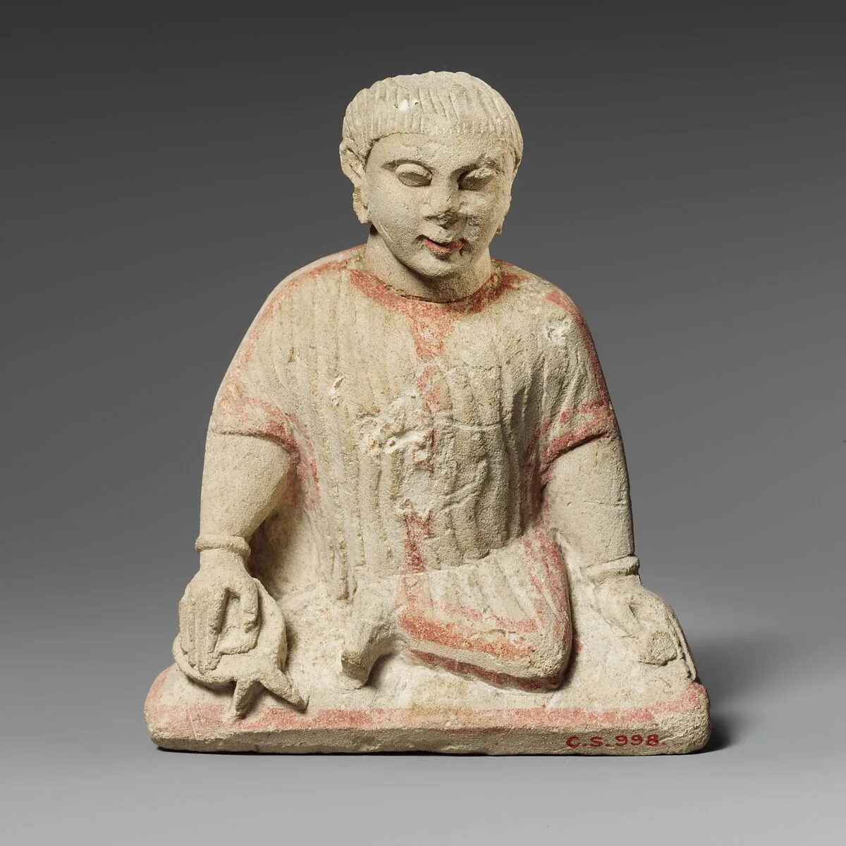 Limestone statuette of a temple boy — Unknown
