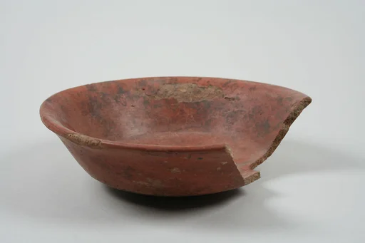Undecorated painted bowl with flared sides