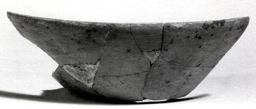 Undecorated painted bowl with flared sides
