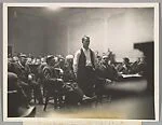 CROWN POINT, IND. John Dillinger, the notorious outlaw, as he stood in a Crown Point Court today, and heard his death trial set for March 12. Dillinger is pictured as he heard the arraignment
