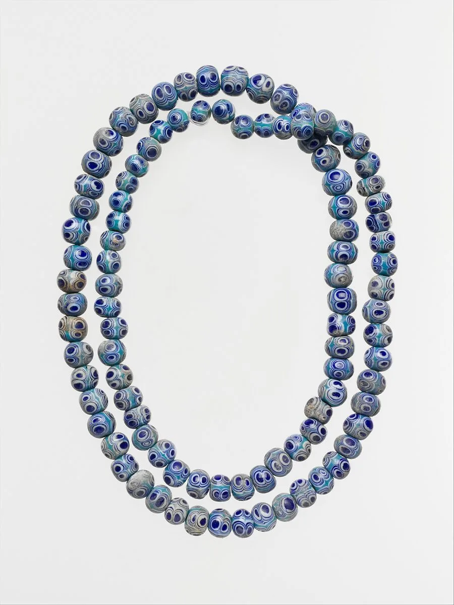 String of ninety-seven glass eye beads — Unknown