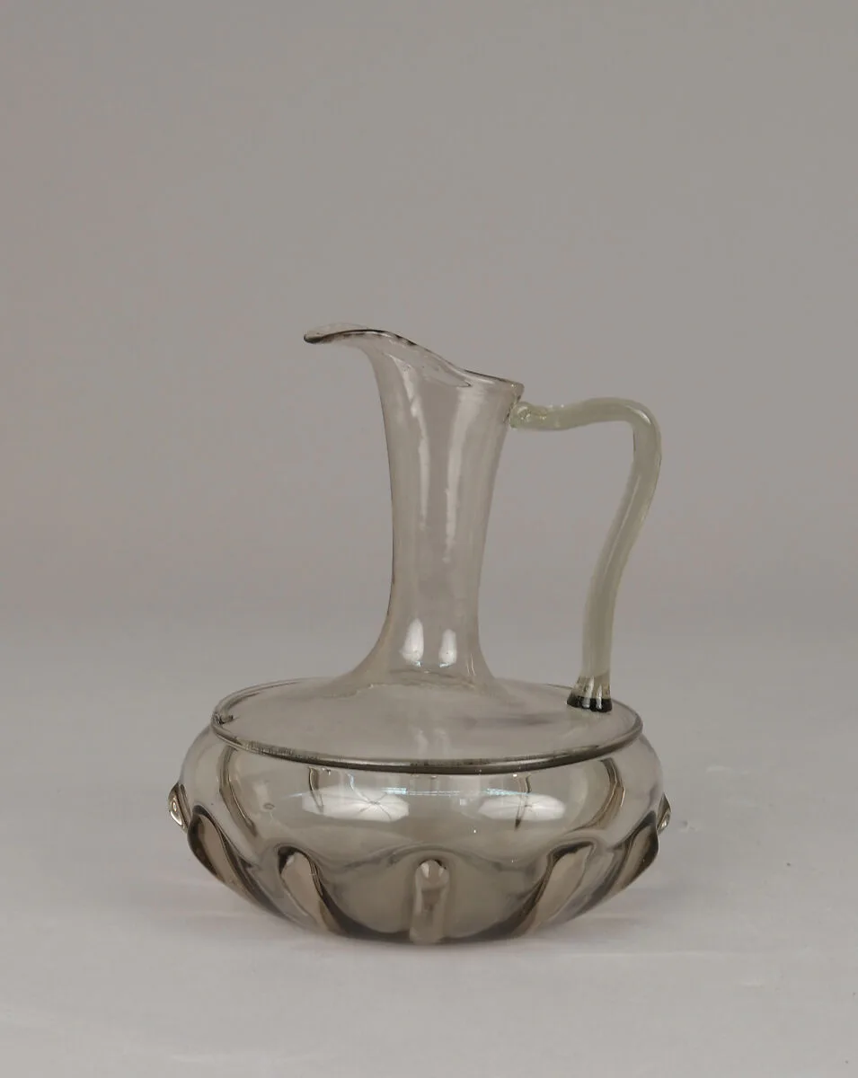 Partially-ribbed, amber-toned cruet bottle — Unknown