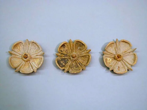 Three gilded terracotta appliqués