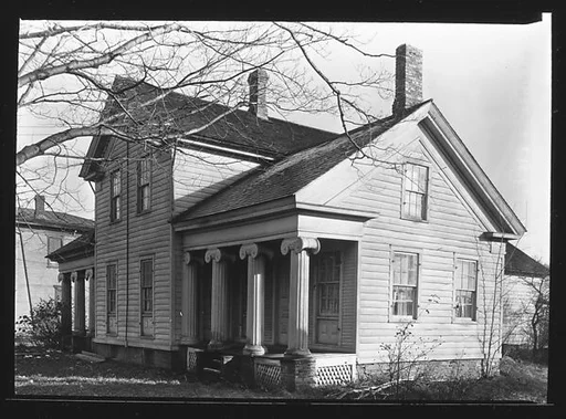 [Greek Revival House with Side Gables and Ionic Capitals]