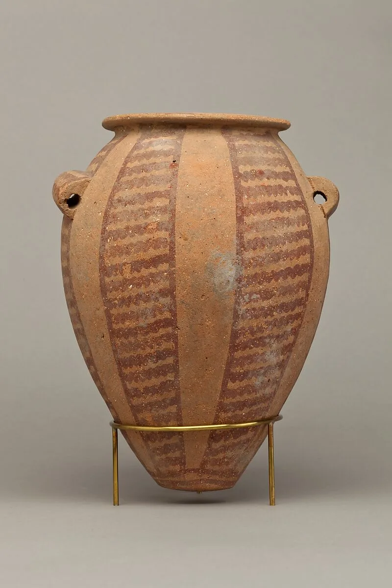 Decorated ware jar with vertical bands of wavy lines — Unknown