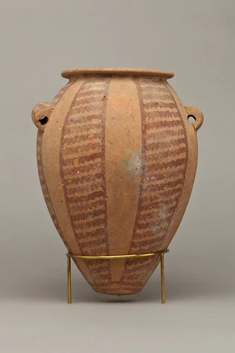 Decorated ware jar with vertical bands of wavy lines