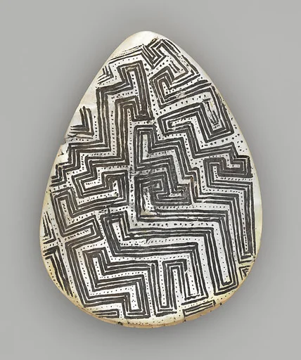 Engraved pearl shell
