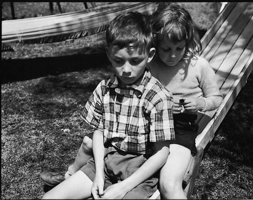 [Robert and Lee Workum on Slide, Bedford Village, New York]