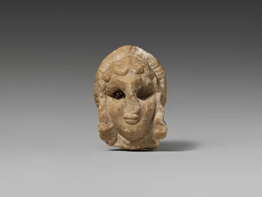 Female head with elaborate hairstyle