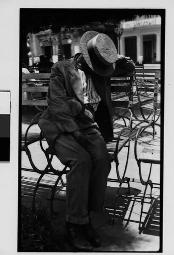 [Man Wearing Boater Asleep on Bench in Park, Havana]