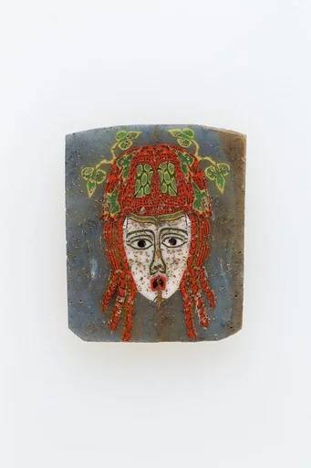 Plaque, female face