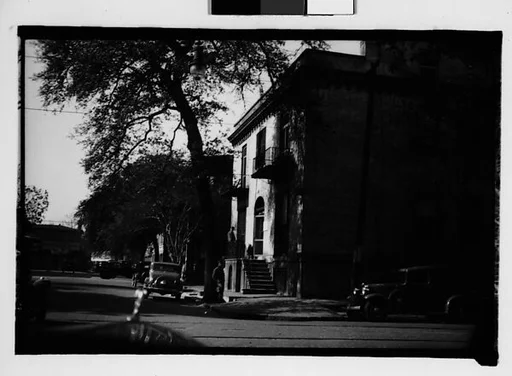 [Italianate Town House and Parked Cars on Corner, From Automobile, Savannah, Georgia]