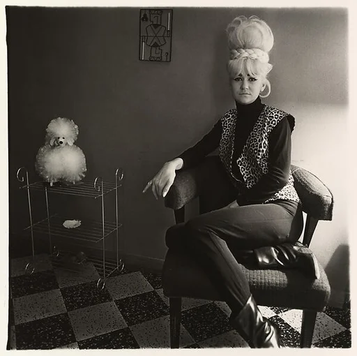 Lady bartender at home with a souvenir dog, New Orleans