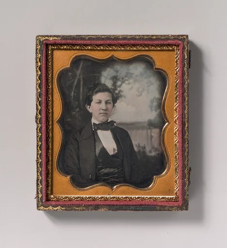 [Young Man Seated in Front of Painted Outdoor Backdrop]