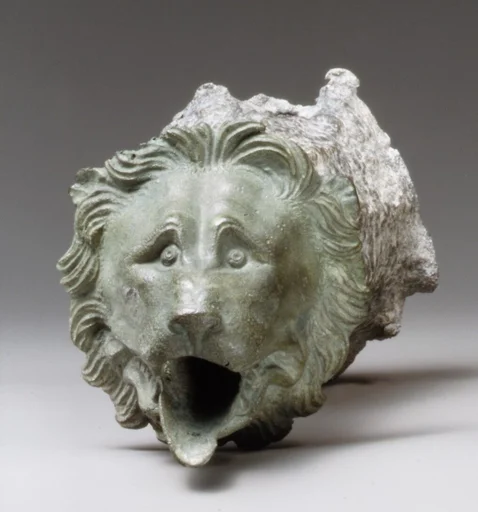 Bronze water spout with lion mask (one of a a pair)