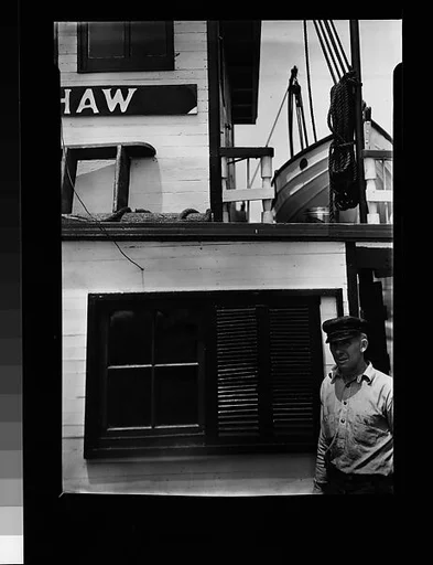 [Seaman Posing Next to Ship's Cabin Façade: "RUTH SHAW"]