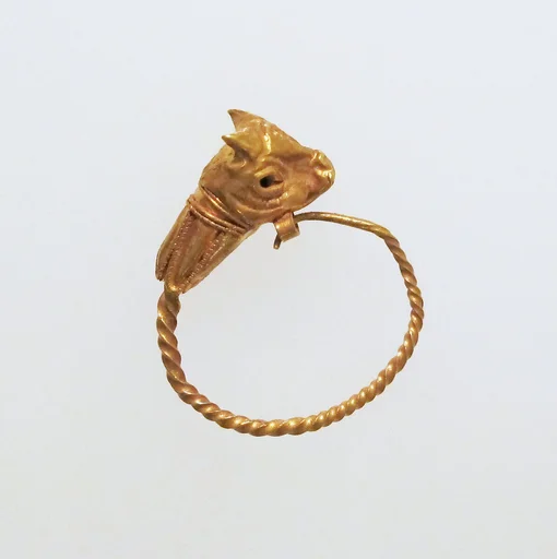 Gold earring with head of a bull