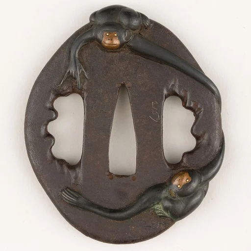 Sword Guard (<i>Tsuba</i>) Depicting Two Gibbons (二疋手長猿図鐔)