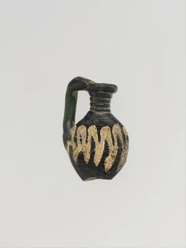 Glass pendant shaped like a jug
