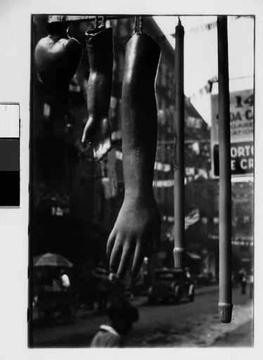 [Two 35mm Film Frames: Hanging Wax Votive Candle Display, Roosevelt Street, New York City]