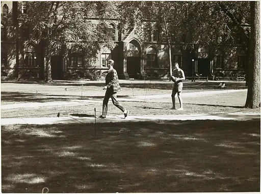 [Young Man on Footpath and Shirtless Student Holding Football in Yard, Yale University Campus, New Haven, Connecticut, Possibly for Unpublished Fortune Portfolio "The Clothes"]