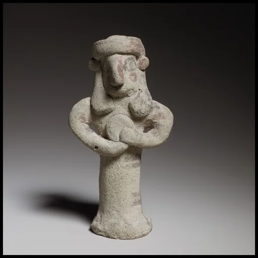 Standing figure holding a tambourine(?)