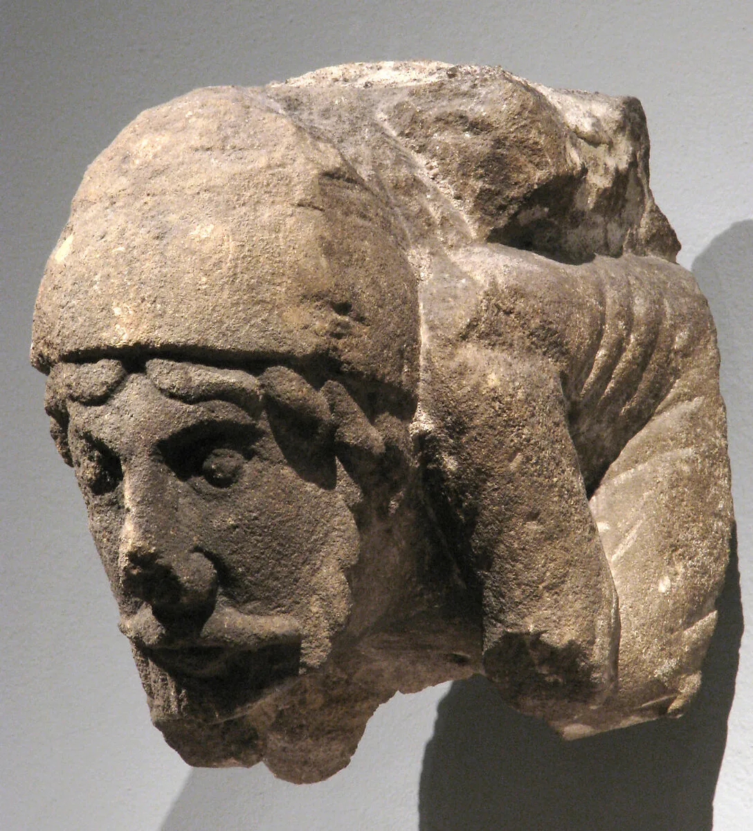 Corbel with Crouching Male Figure — Unknown