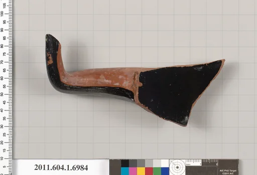 Terracotta fragment of a kylix (drinking cup)