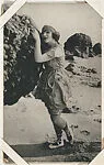 Bathing beauty in costume with arms on rock from Mack Sennett Comedies Arcade series (W423) — Unknown