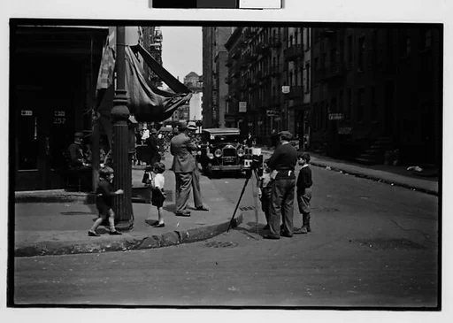 [Two 35mm Film Frames: Tintype Photographer and Group on Street Corner, New York City]