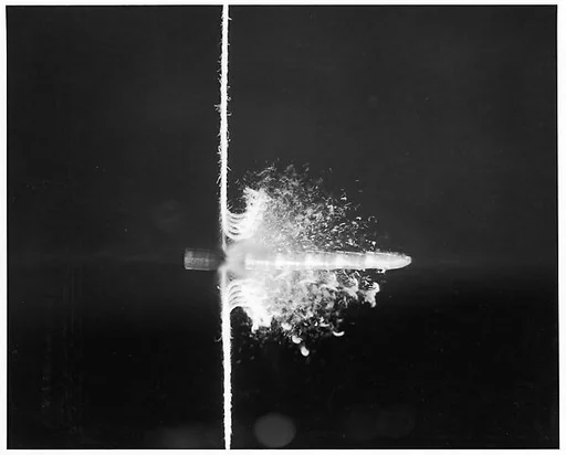 [Motion Study of Bullet Cutting Through String with Six Stroboscopic Flashes]
