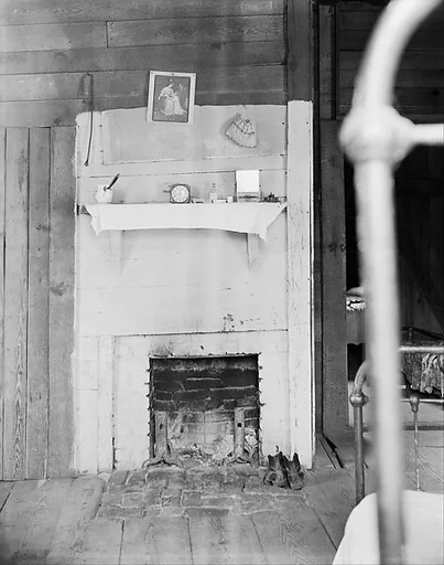 [Fireplace (with Bedpost in Foreground) in Floyd Burrroughs's Bedroom, Hale County, Alabama]