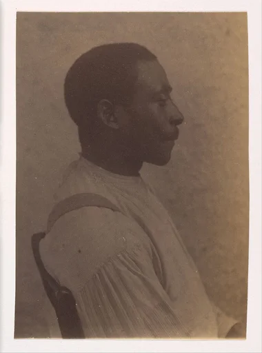 [Profile of a Seated African American Man]