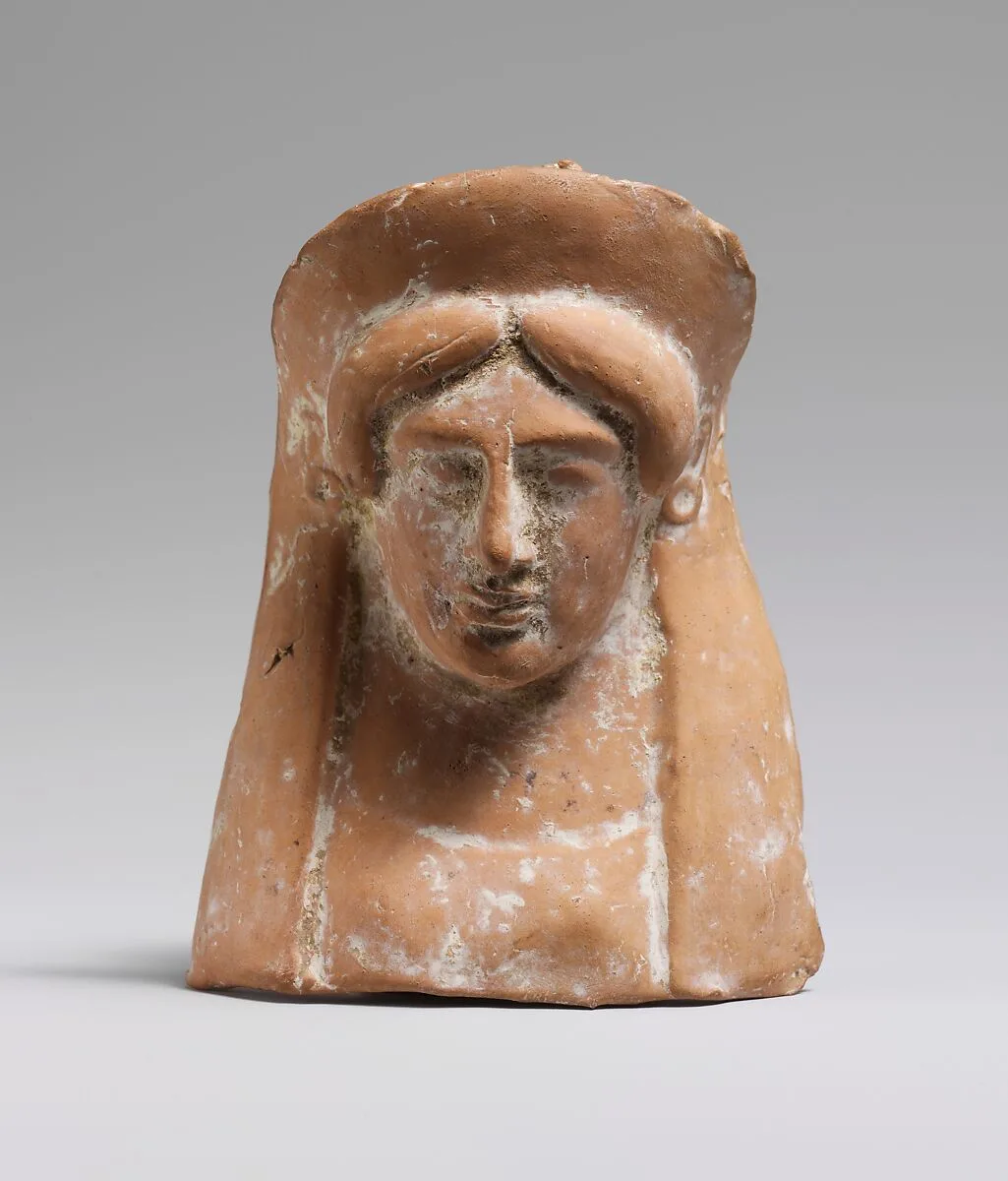 Terracotta relief with the head and neck of a woman — Unknown