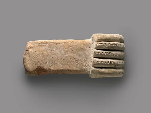 Miniature corbel in the shape of a hand
