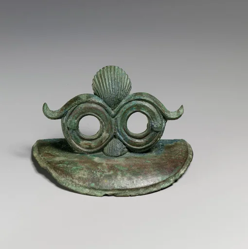 Pair of bronze handle attachments from a situla (bucket)