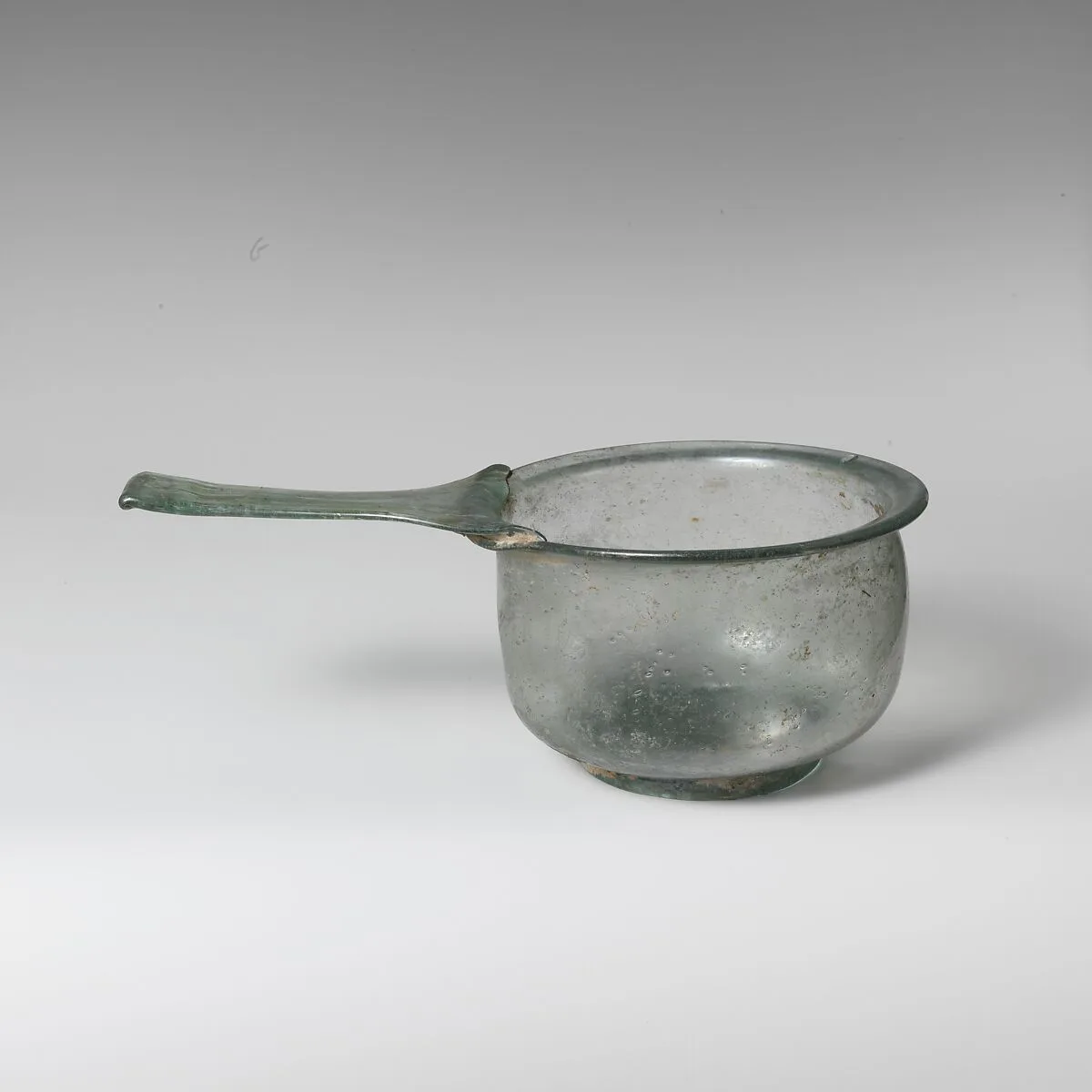 Glass trulla (pan) — Unknown