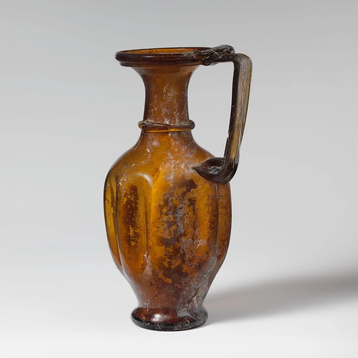 Glass jug with indented body — Unknown