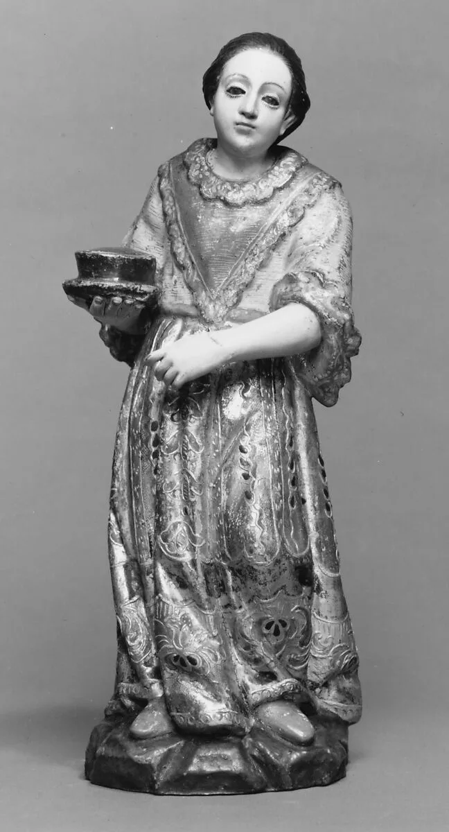Standing woman with a bowl on a plate from a nativity — Unknown