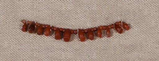 String of Carnelian Beads and Poppy Pendants