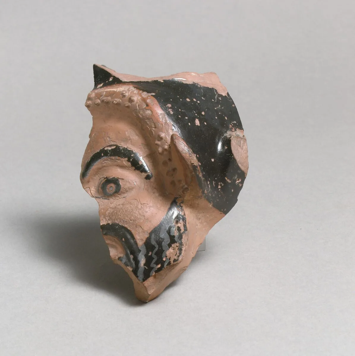 Vase fragment in the form of a satyr's head — Class O: The Sabouroff Class of Head Vases