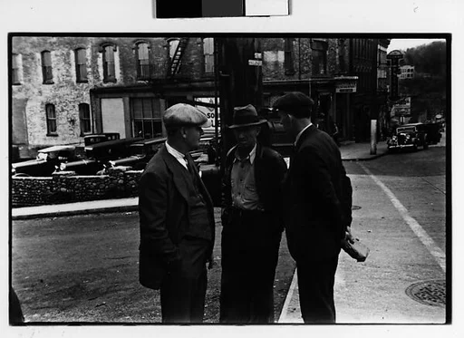 [Two 35mm Film Frames: Three Men in Conversation on Street, Street Conversation with Pedestrian in Foreground, Ossining, New York]