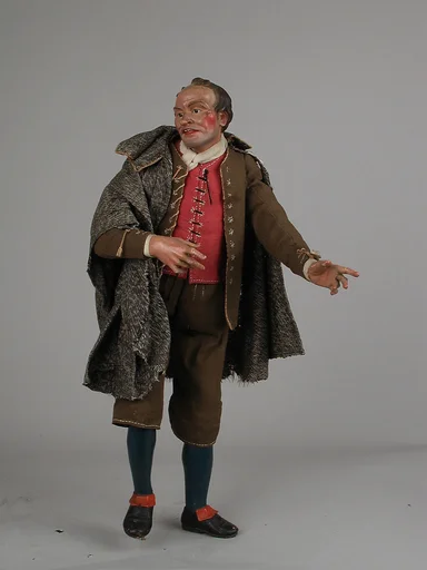 Man with cape and leather pouch