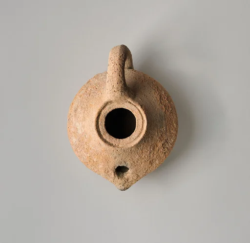 Terracotta oil lamp