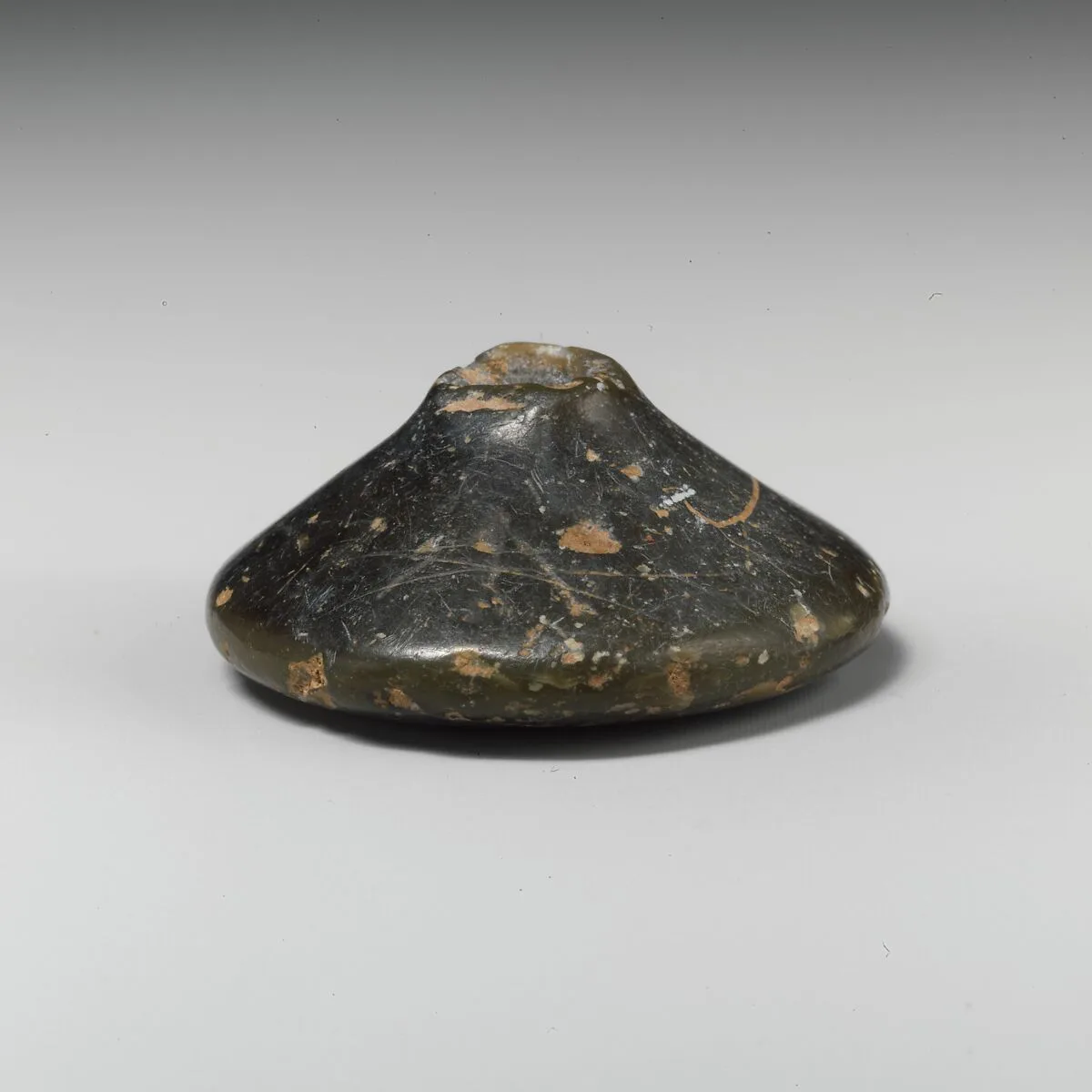 Stone spindle whorl — Unknown