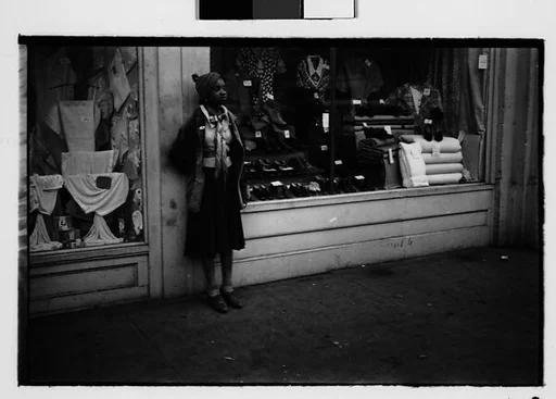 [Two 35mm Film Frames: Young Woman Outside Clothing Store, Georgia]