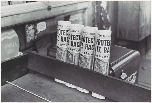 [Daily Mirror Newspapers for Sale at Grocery, East 61st Street, New York]