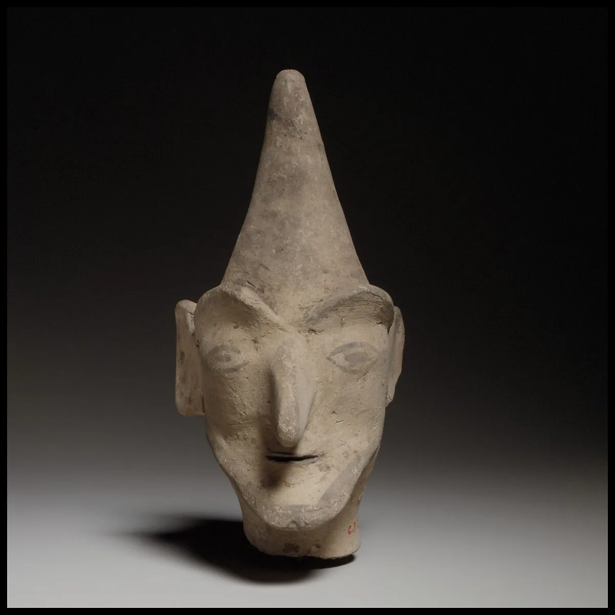 Male head wearing a helmet — Unknown